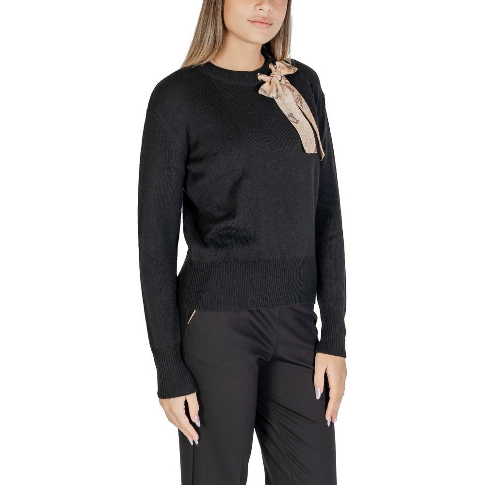 Woman wearing Alviero Martini Prima Classe black polyester sweater, fall/winter collection, showcasing elegant women's knitwear.