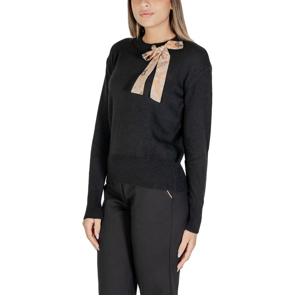 Woman wearing Alviero Martini Prima Classe black polyester sweater with bow detail, part of the women's fall/winter knitwear collection.