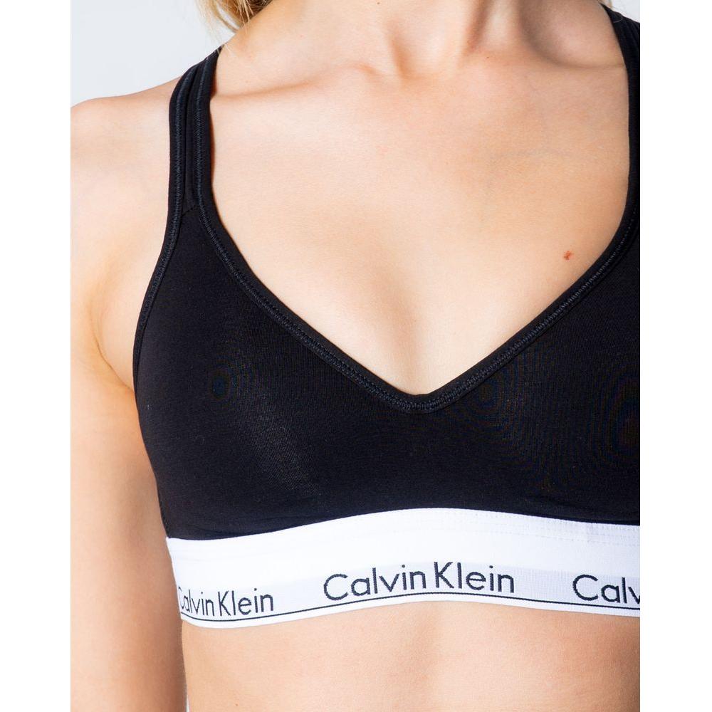 Calvin Klein black polyester bralette with logo band, offering comfort and support for everyday wear.