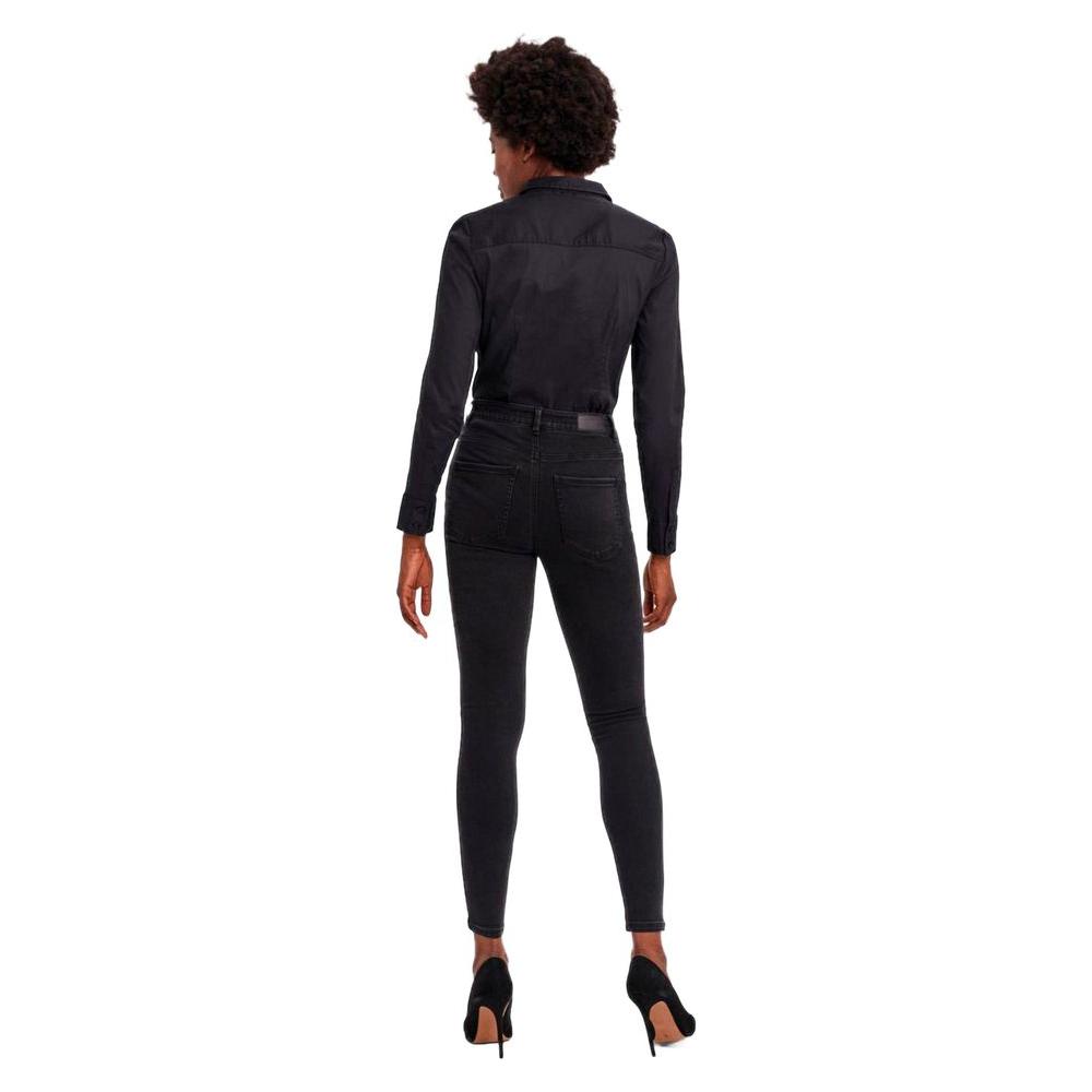 Model wearing Vero Moda black cotton long-sleeve top with high-waisted black jeans, viewed from the back