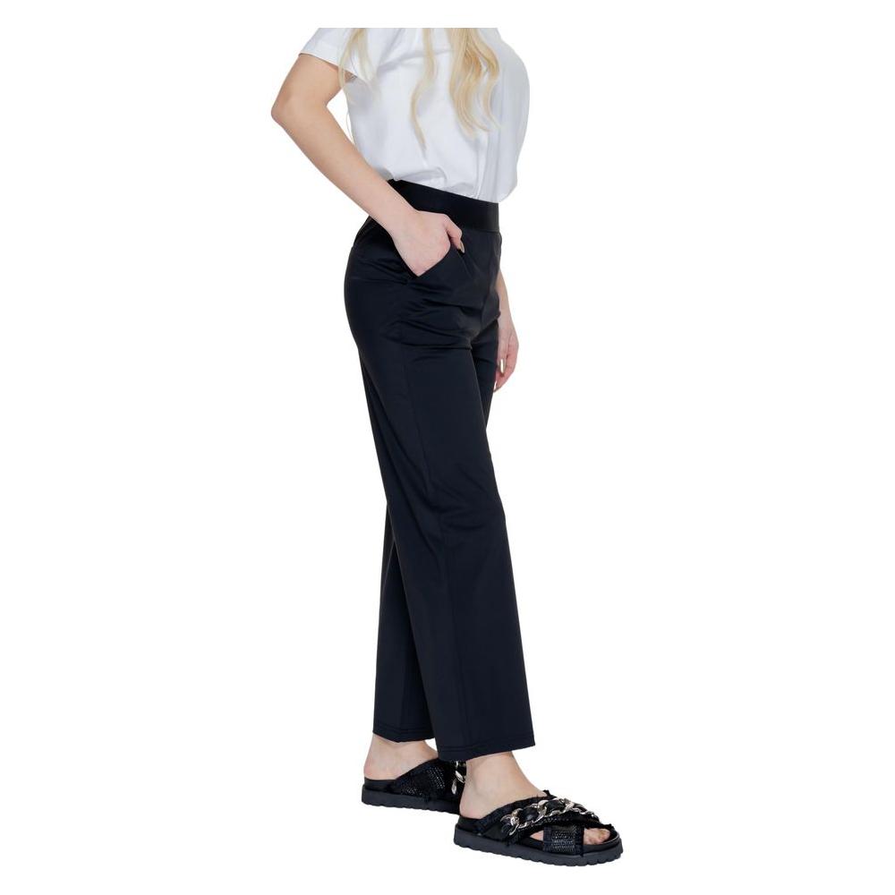 Woman wearing Street One black polyamide palazzo pants, perfect for spring-summer fashion with a comfortable fit and chic style.