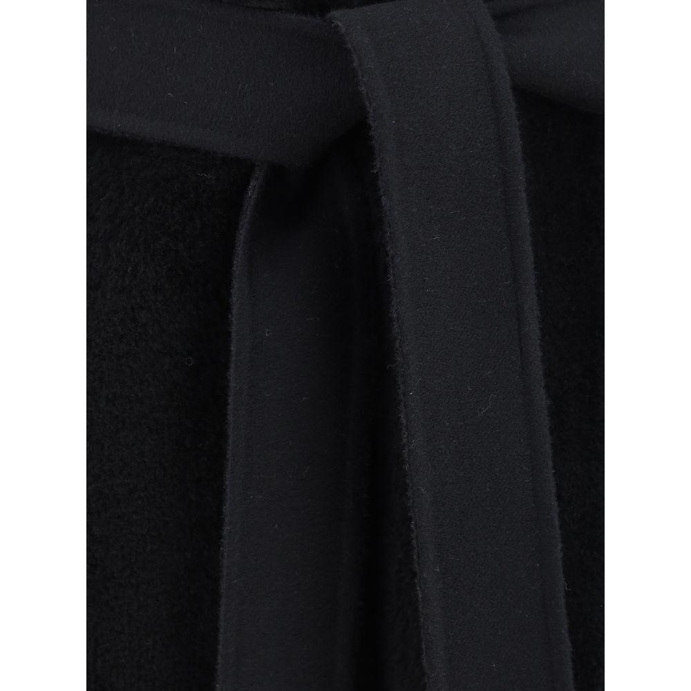 Close-up of Fendi virgin wool coat with knotted sash and monochrome pattern
