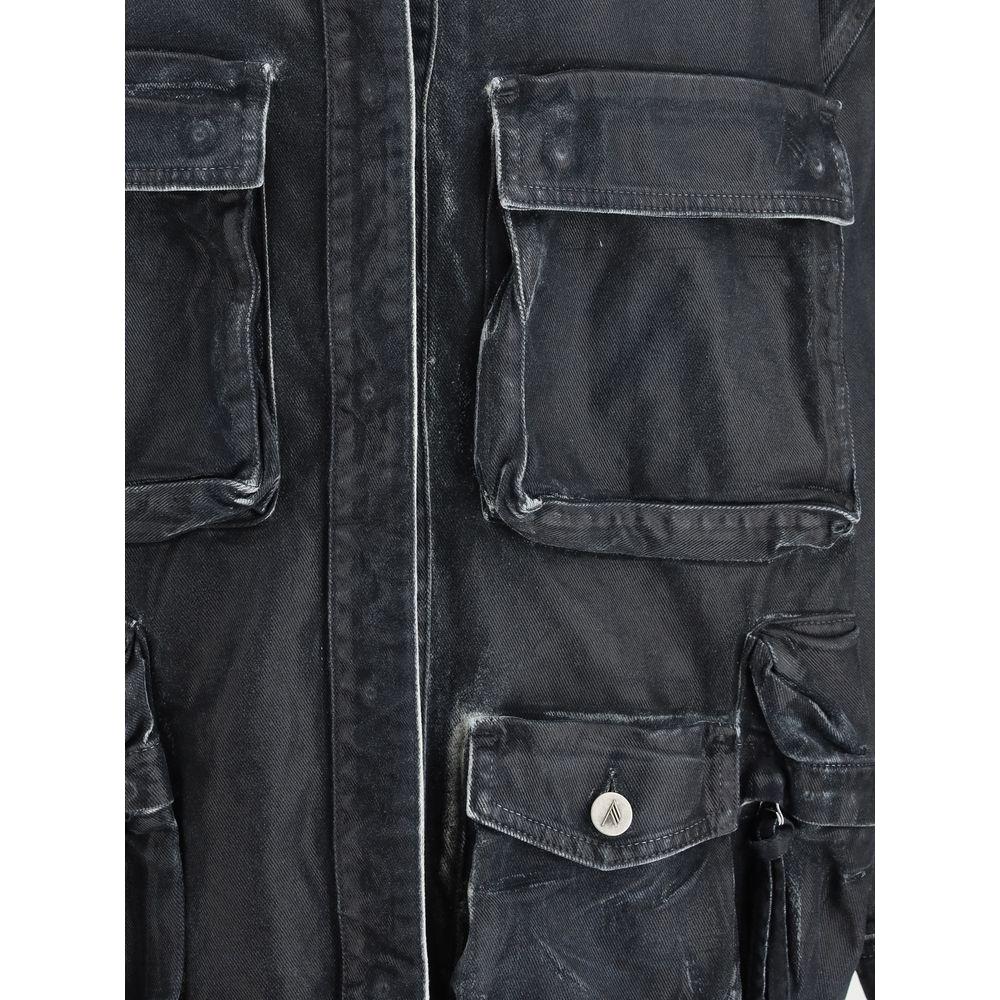 Close-up of The Attico Fern Denim Jacket featuring patch cargo pockets, snap button closure, and vintage worn effect in black denim.