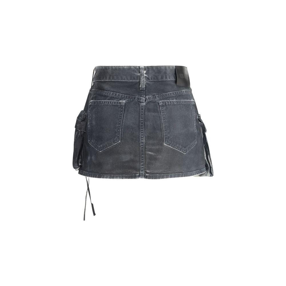 The Attico denim cargo mini skirt, featuring a five-pocket design and iconic branded leather patch, with front and side cargo pockets.