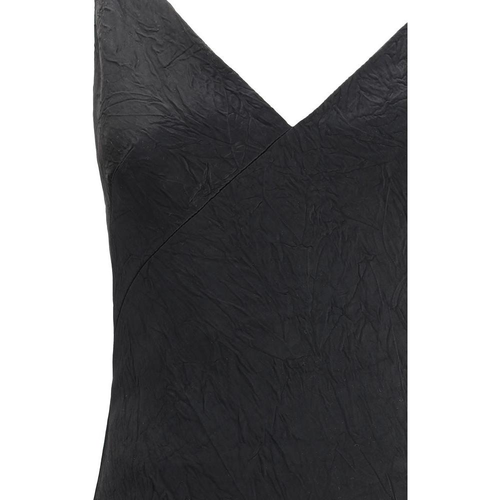 Alexander McQueen Cracked Finish Long Dress with V-neck and crinkle texture, showcasing elegant style and unique design.