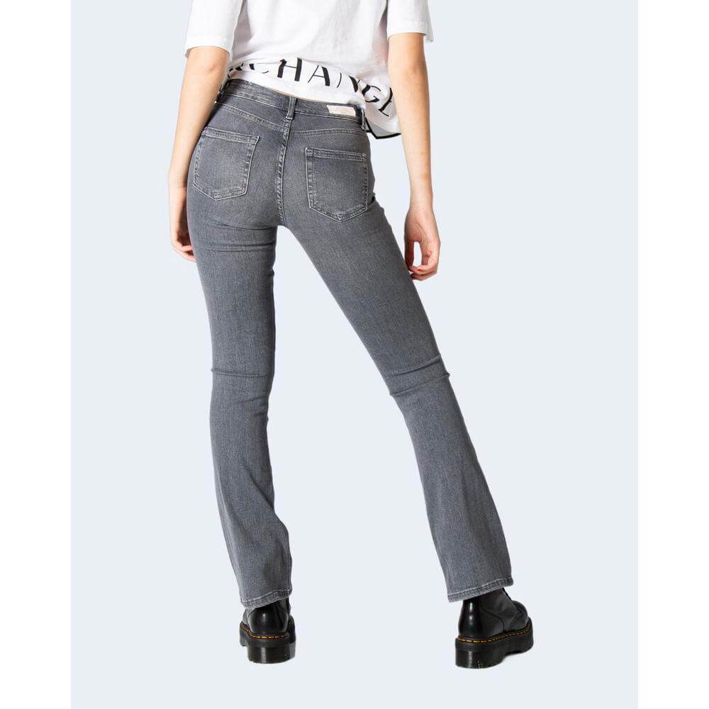 Woman wearing gray mid flared slim jeans with stretch, back view for fashion and style.