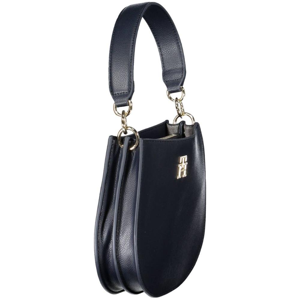 Tommy Hilfiger blue handbag with gold accents and two compartments, made from recycled polyester for stylish and sustainable fashion.