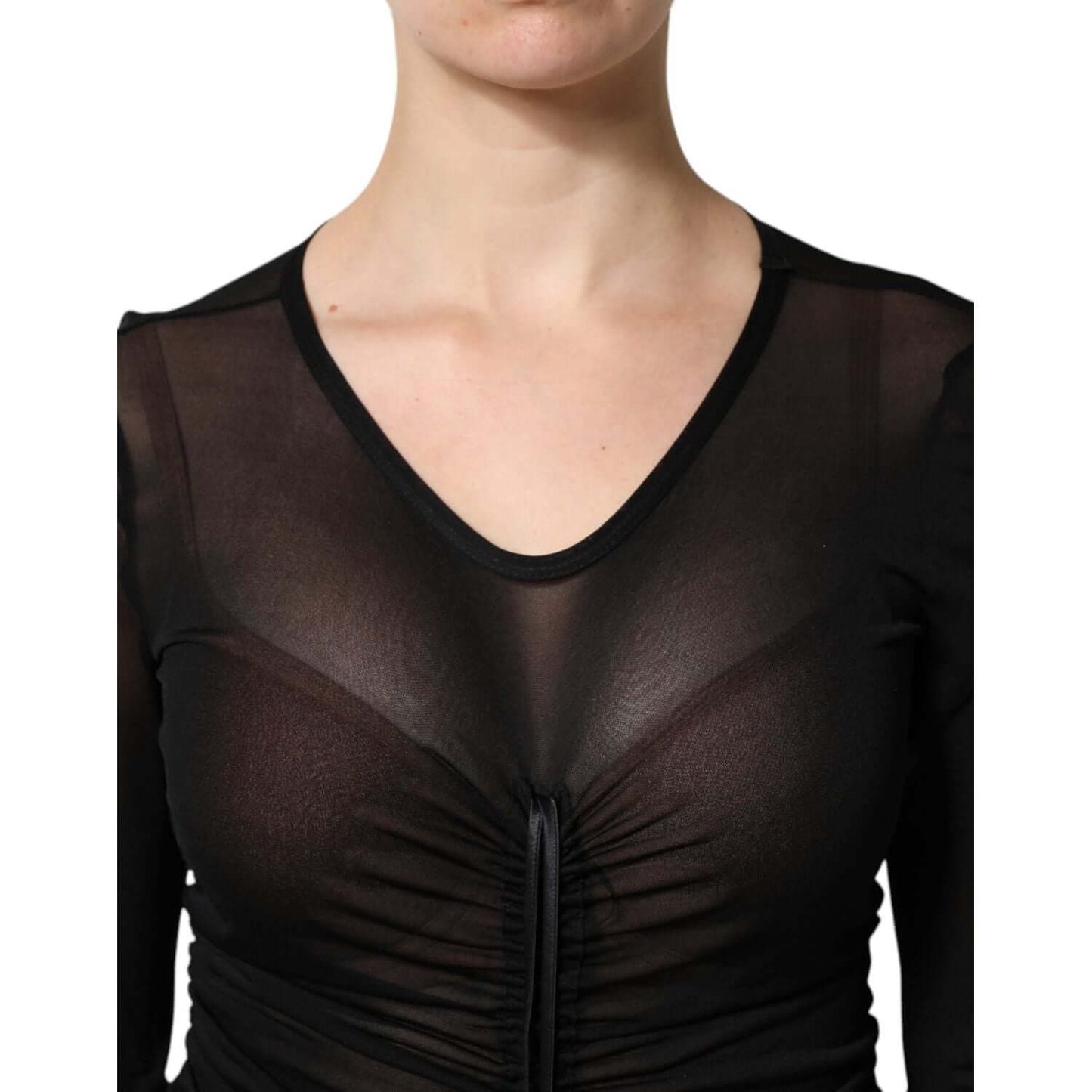 Close-up of a Dolce & Gabbana black mesh trim bodycon long sleeve dress, showcasing elegant tulle material and craftsmanship.