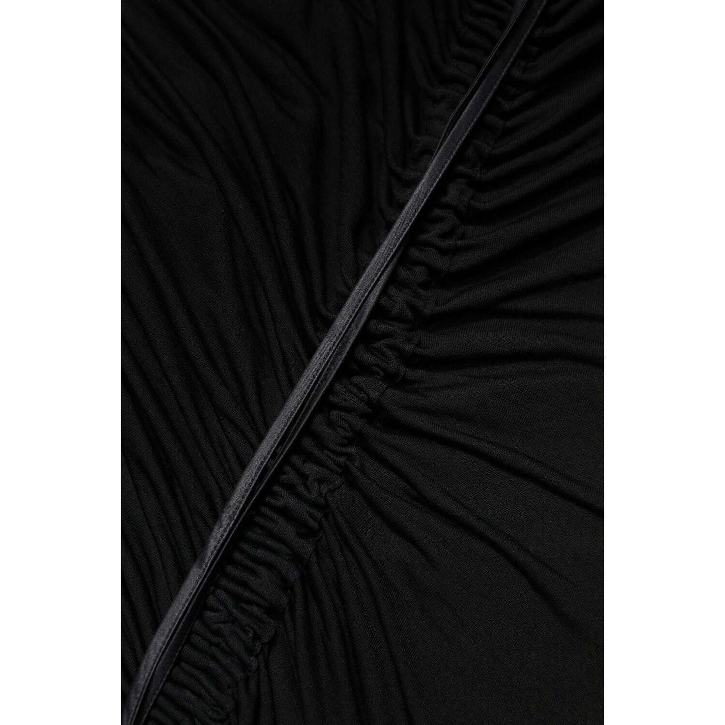 Close-up of Dolce & Gabbana black mesh trim detail on bodycon dress with zipper, showcasing high craftsmanship and elegant design.