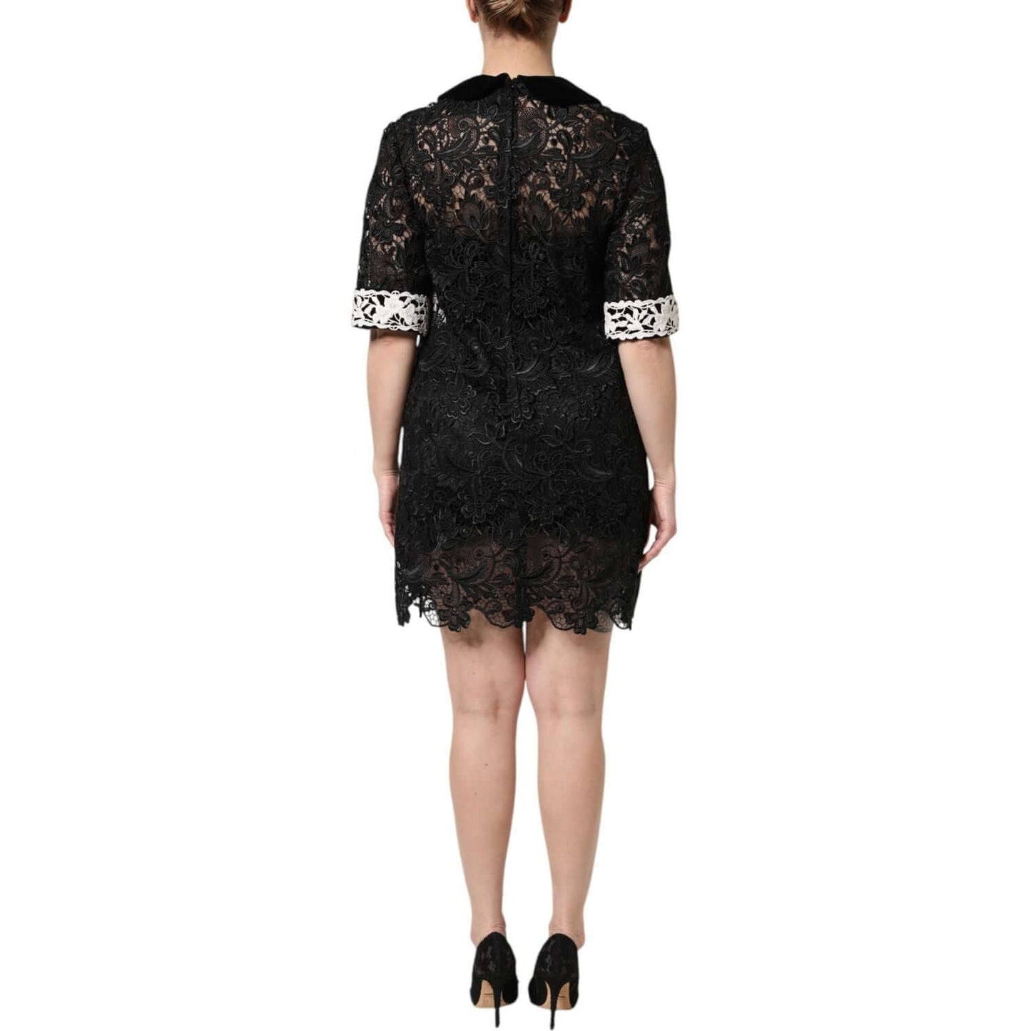 Back view of Dolce & Gabbana Black Floral Lace Embellished Mini Dress with white cuffs, showing intricate design and exclusive craftsmanship.