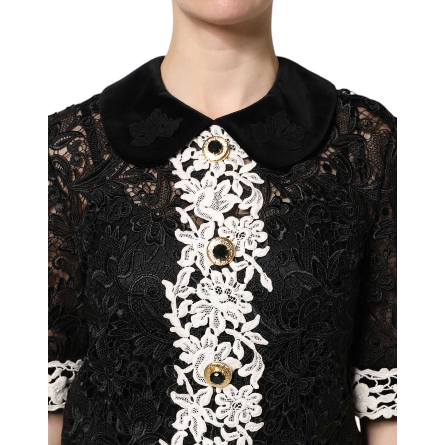 Dolce & Gabbana black floral lace mini dress with white embellishments, close-up on intricate detailing and classic design.