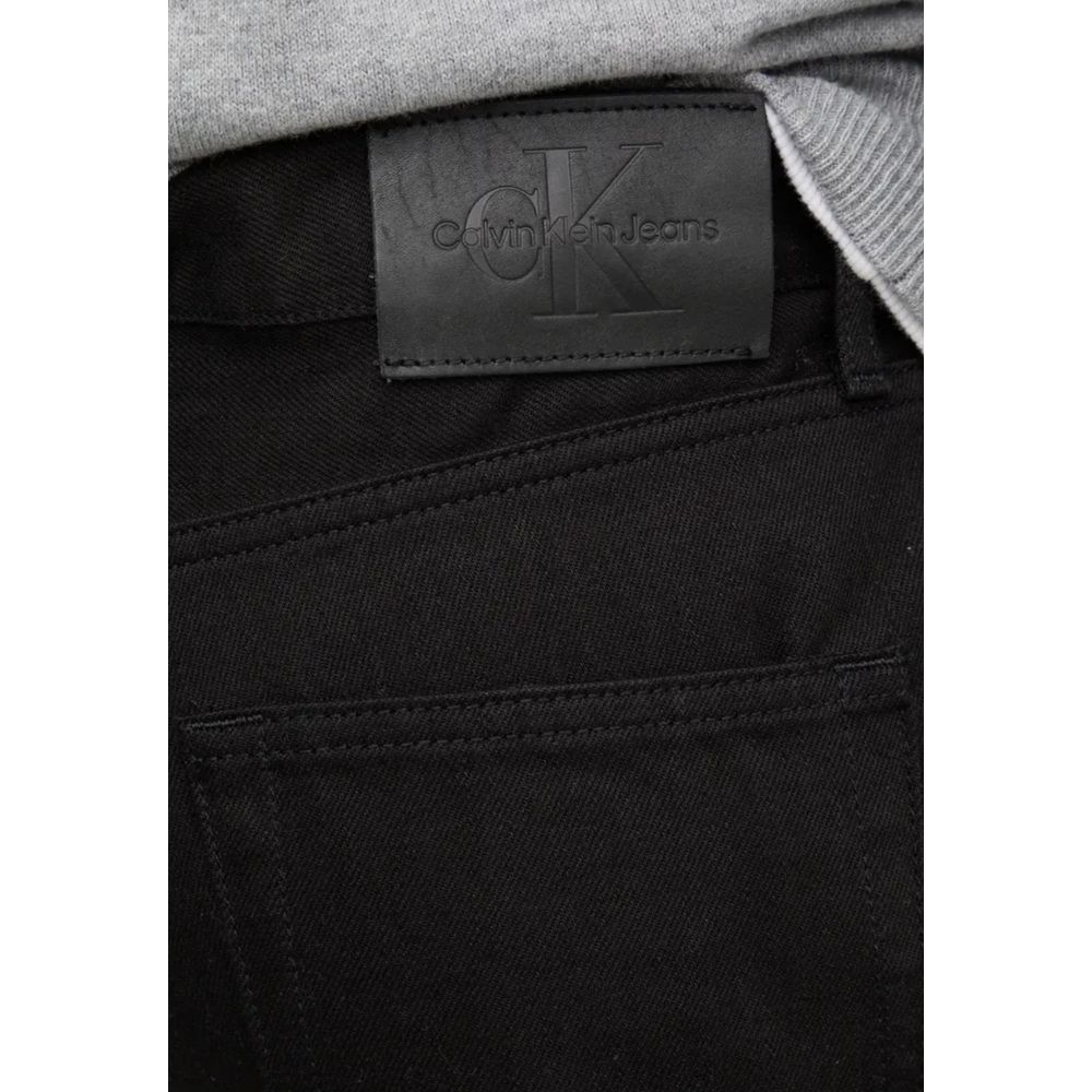Calvin Klein Jeans Black Cotton Relaxed Fit Jeans close-up showing label and pocket details.
