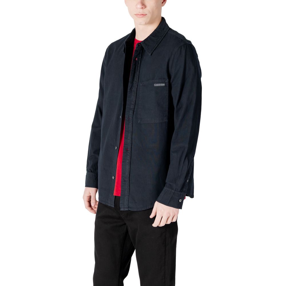Model wearing Calvin Klein Jeans Black Cotton Shirt with regular fit and chest pocket, suitable for casual occasions.