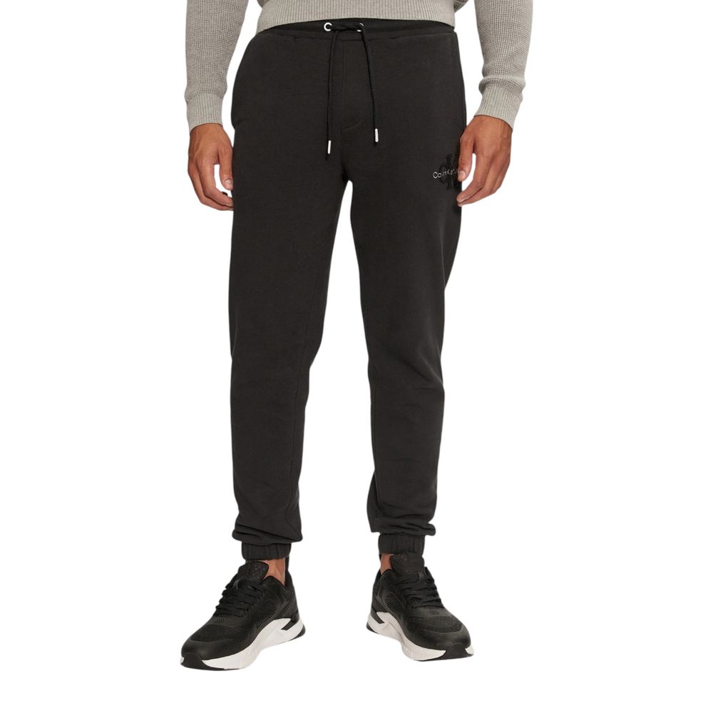 Model wearing Calvin Klein Jeans Black Organic Cotton Joggers (Workout Pants) with logo, showcasing comfort and style.