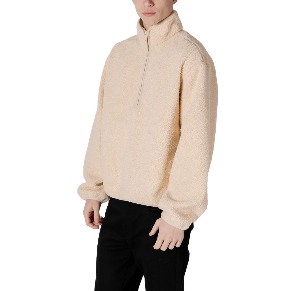 Man wearing Calvin Klein Jeans Cream Recycled Polyester Shell Jacket, half-zip design for modern style and comfort.