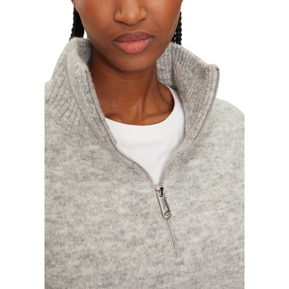 Woman wearing Calvin Klein Jeans Gray Polyester Cardigan with half-zip design, showcasing texture and elegance ideal for cool days.
