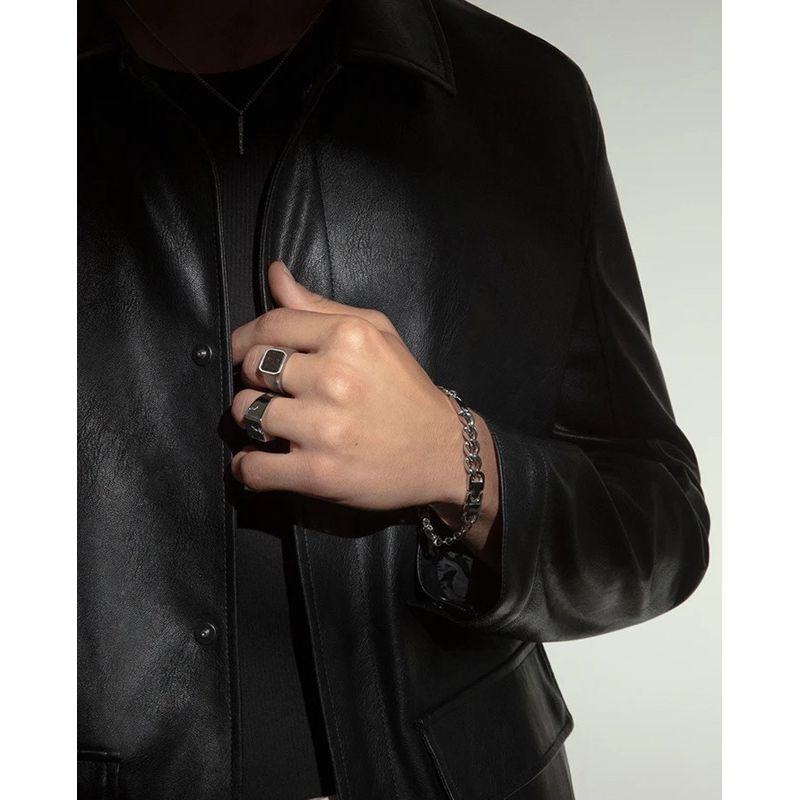 Gent wearing VICEROY FASHION Mod. 75376A02011 silver ring, paired with a stylish leather jacket, showcasing elegant men's fashion accessories.