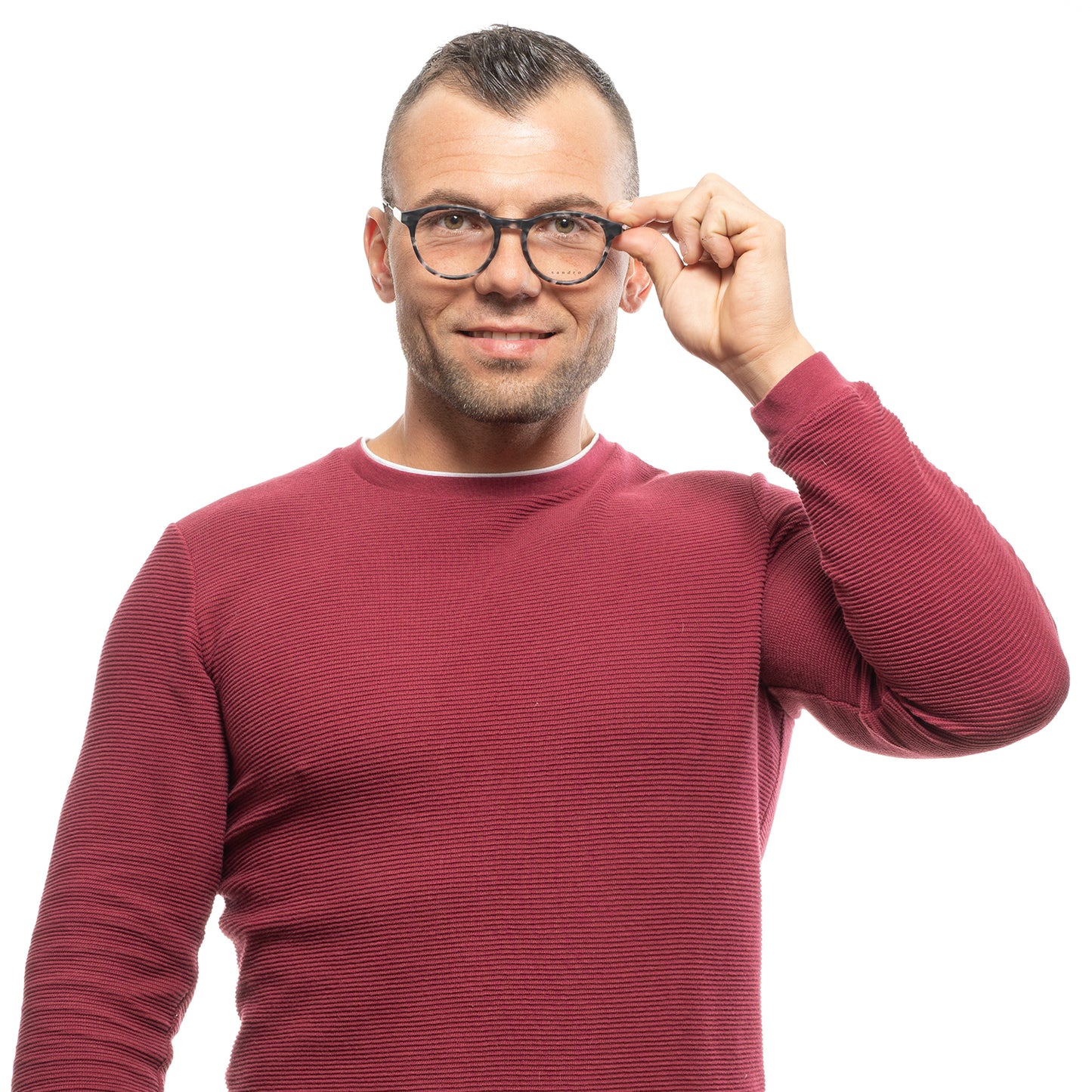 Man wearing glasses and a red sweater smiling confidently