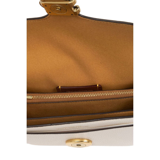Coach Tabby 20 leather crossbody bag with multifunctional internal pockets and snap closure
