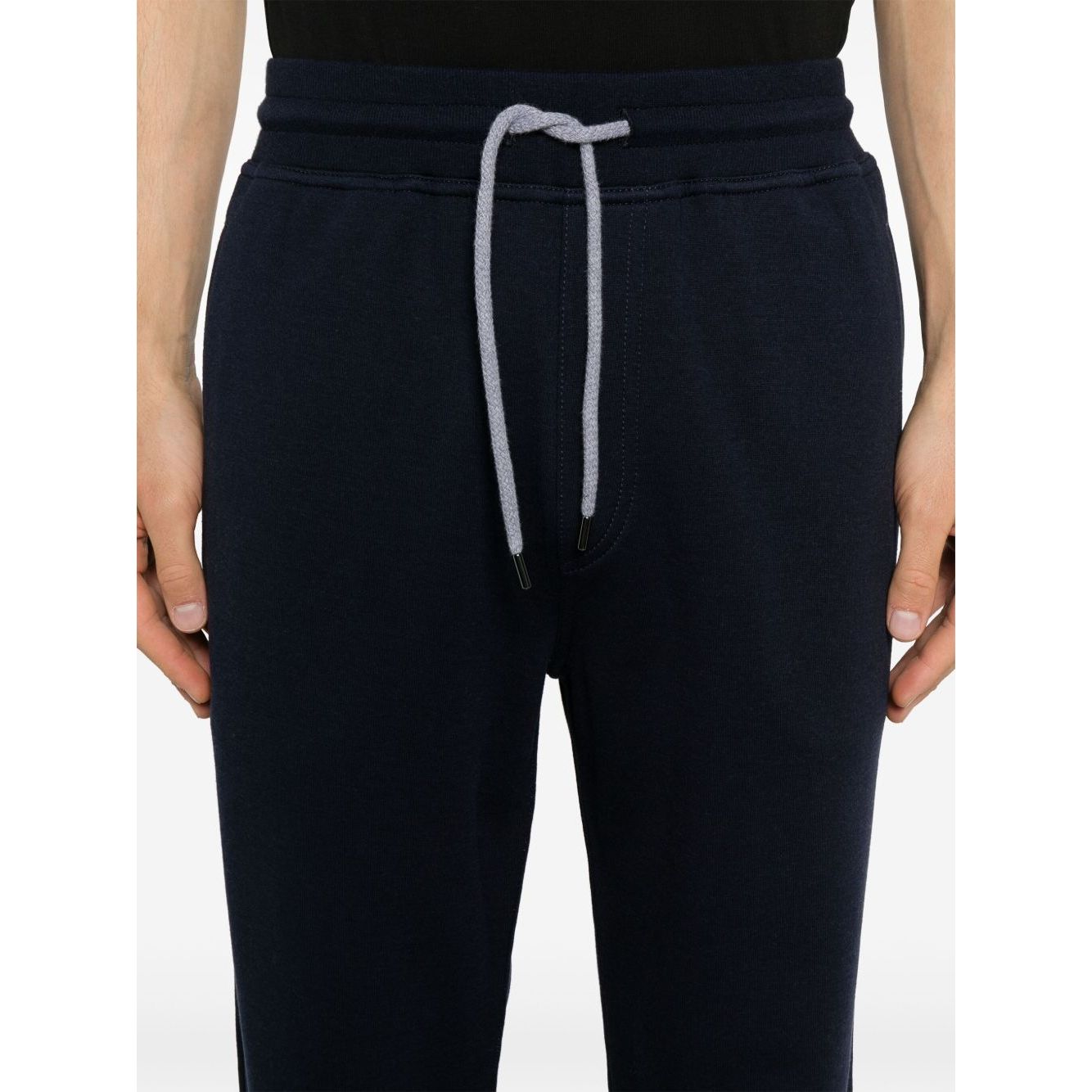 Close-up of Brunello Cucinelli Trousers Blue with elasticated waistband, drawstring, and tapered leg design in navy cotton blend.