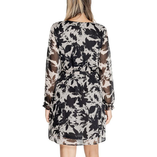 Back view of a Jacqueline De Yong black recycled polyester dress, featuring a floral pattern, ideal for fall and winter women’s fashion.