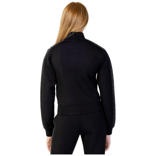 Back view of Guess Active Black Viscose Sweater worn by a model, showcasing sleek and sporty design perfect for daily activities.
