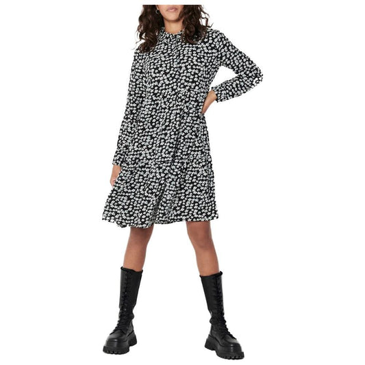 Woman wearing a Jacqueline De Yong white polyester midi dress, styled with black boots for fall and winter collection.