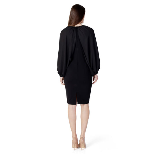 Back view of Rinascimento women's long black polyester dress, spring/summer collection, featuring long sleeves and elegant design.