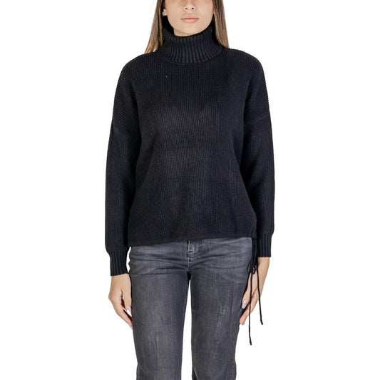 Sandro Ferrone women's black viscose sweater, fall/winter knitwear, front view on model with turtleneck design.