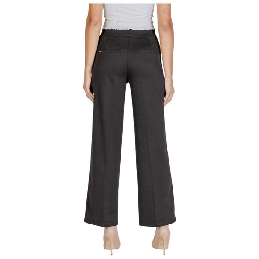 Woman wearing Street One black polyester jeans and pants for fall and winter collection, back view
