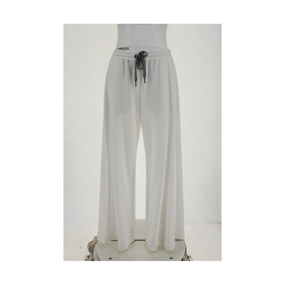 Brunello Cucinelli White Cotton Casual Pants with elastic waistband and drawstring, featuring loose palazzo silhouette and side pockets.