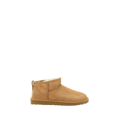 UGG Brown Goatskin Ankle Boots with knurled sole and shearling lining for warmth, featuring iconic monogram and suede design.