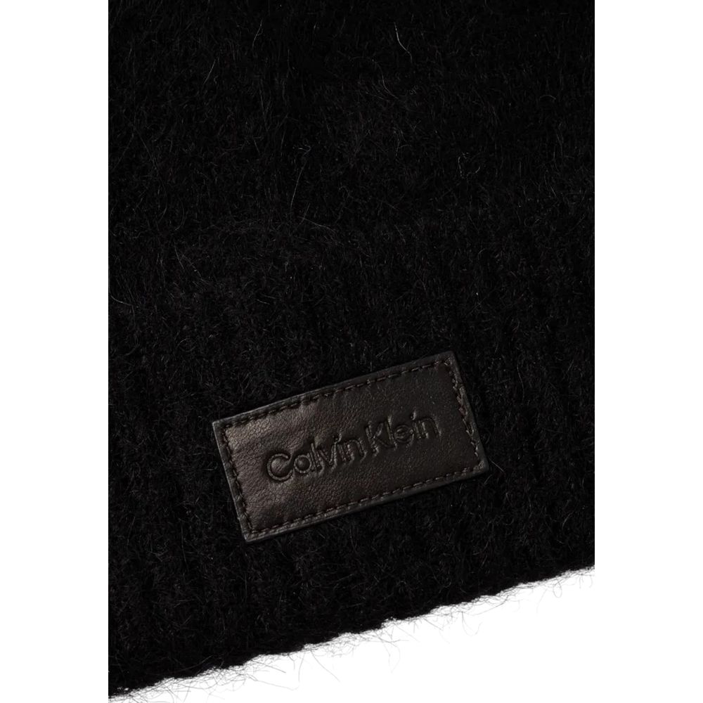 Close-up of Calvin Klein Black Alpaca Leather Cap (Baseball Hat) showing leather logo patch highlighting luxury and style.