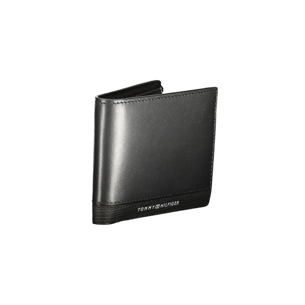 Tommy Hilfiger Black Leather Men Wallet with logo, stylish accessory with compartments and card slots.