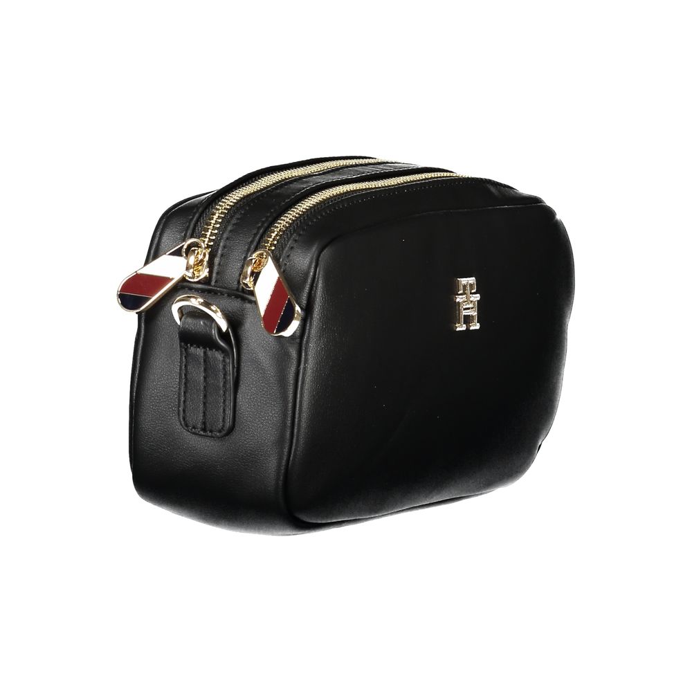 Tommy Hilfiger Black Polyester Women Handbag with dual compartments, adjustable strap, and zip closure. Stylish and practical accessory.
