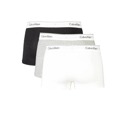 Calvin Klein tri-pack boxers in black, grey, and white with iconic logo waistband.