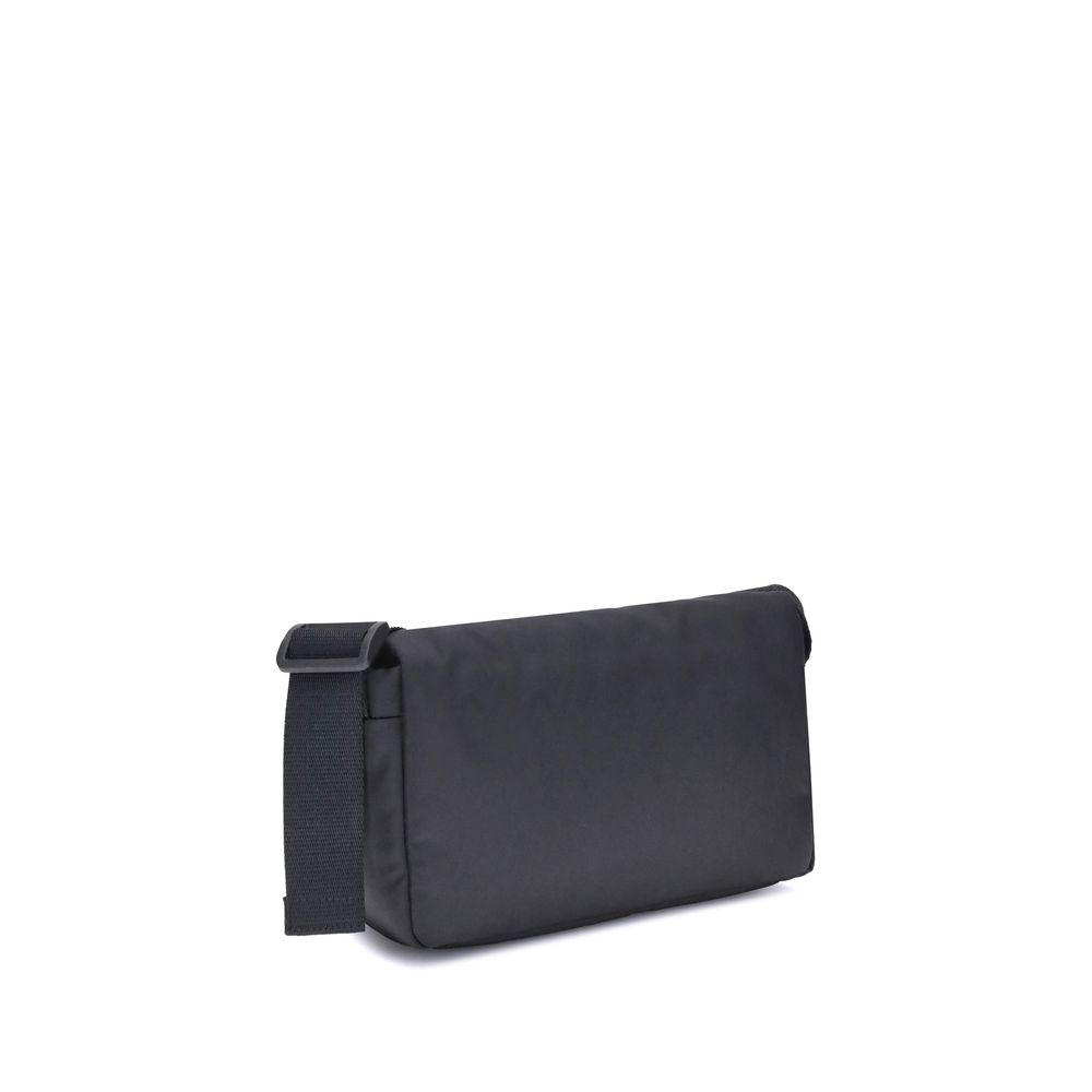 Balenciaga Black Polyamide Shoulder Bag with adjustable strap, minimalist design, and magnetic closure against white background.