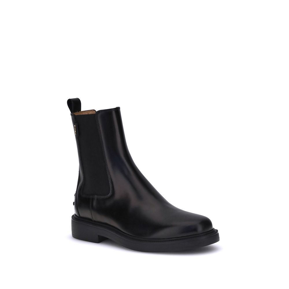 Tod's Black Calf Leather Bos Taurus Chelsea Boots with elastic sides and rubber sole, featuring Tod's logo and pebble details for comfort.