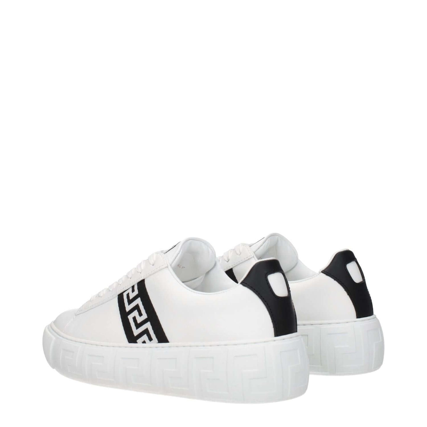 Versace White Leather Low Top Sneakers with black accents, featuring a front logo, lace-up closure, round toe, and rubber sole, side view.