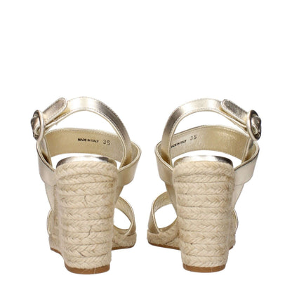 Back view of Prada Gold Leather Wedge Sandals with vintage effect, showcasing espadrille-style wedge heels and ankle straps.