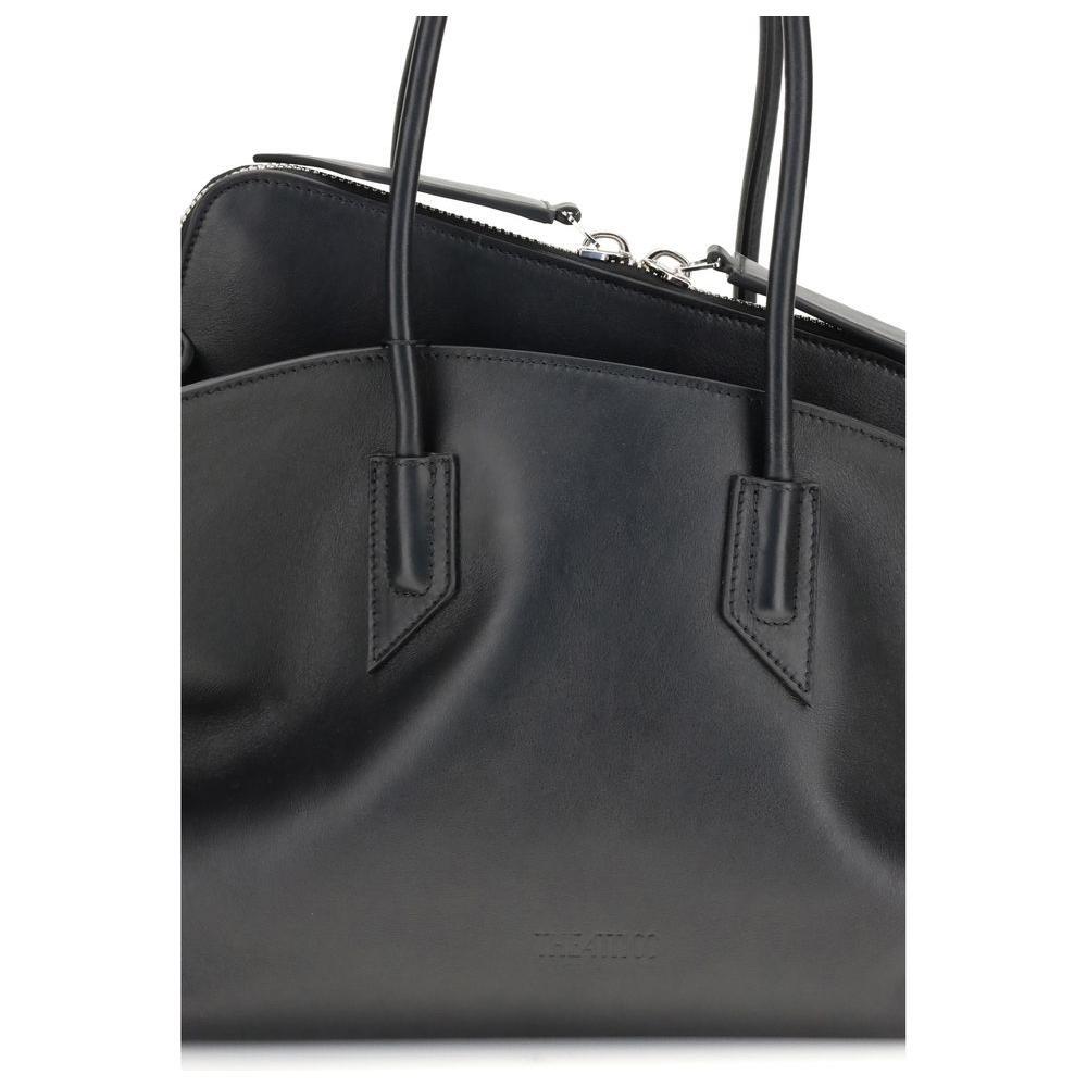 Front view with bag zipped and handles upright.