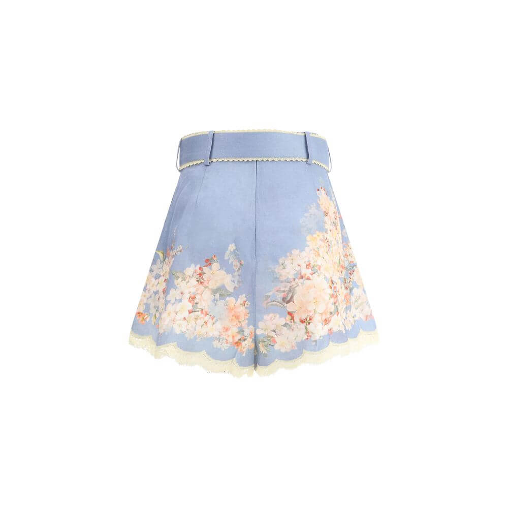 Zimmermann Light Blue Linen Bermuda Shorts with botanical print and belted waist, perfect for a chic summer look.