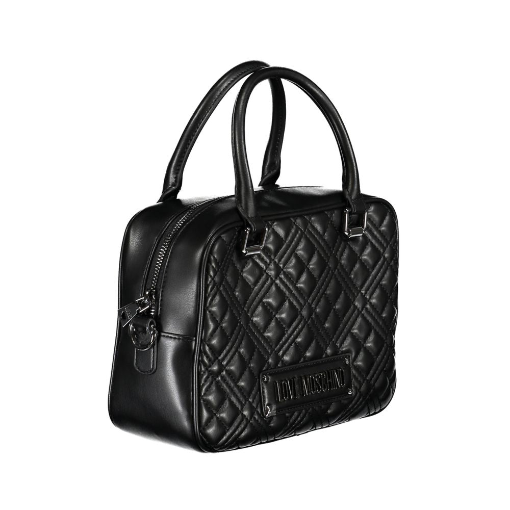 Front view with bag zipped and handles upright.