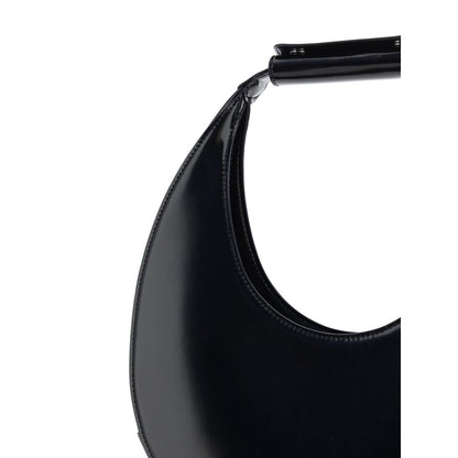 Close-up of Staud Black Calf Leather Bos Taurus Shoulder Bag showcasing iconic round moon shape and rigid handle.