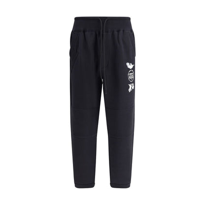 Y-3 Black Cotton Joggers (Workout Pants) featuring elastic cuffs and logo detailing, made from 100% cotton for casual and sporty wear.