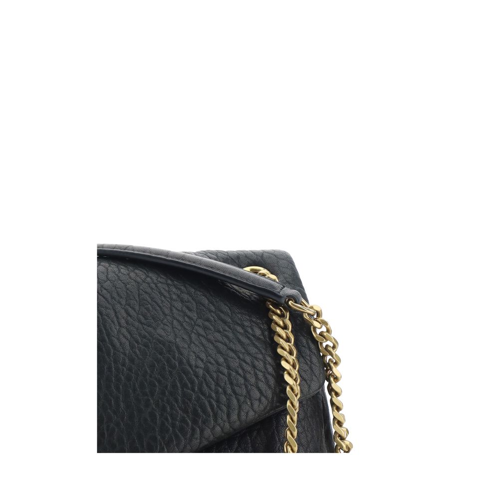 Close-up of Saint Laurent Black Lamb Ovis Aries Aries Shoulder Bag with chain handle and grained leather.