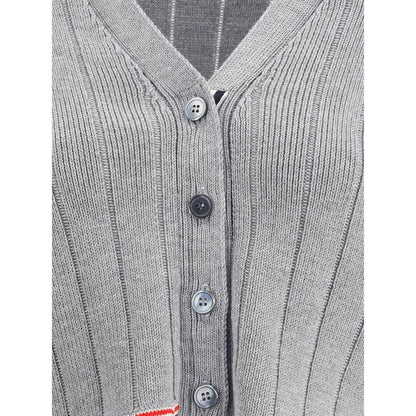 Thom Browne Gray Fleece Wool Cardigan with ribbed design, V-neck, button closure and iconic colored bands. Elegant and contemporary style.