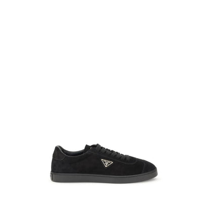 Prada Black Calf Leather Bos Taurus Low Top Sneakers with triangular plaque and logo, flat rubber sole, made in Italy.