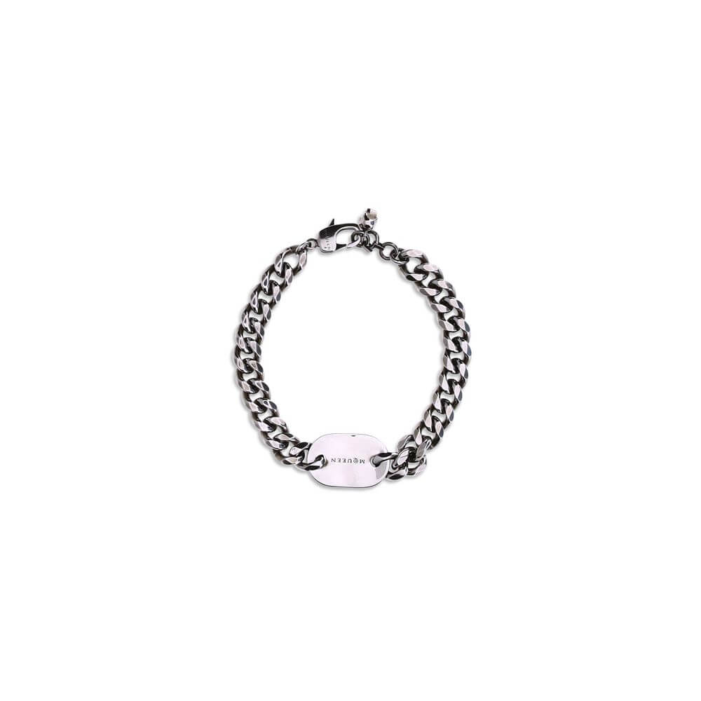 Alexander McQueen Silver Brass Bracelet with chain and engraved skull tag on white background