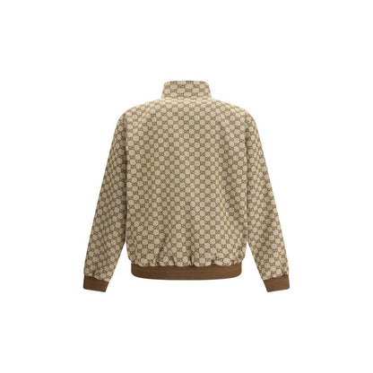 Back view of Gucci Beige Cotton Shell Jacket with GG Supreme design, featuring high collar and ribbed hem.